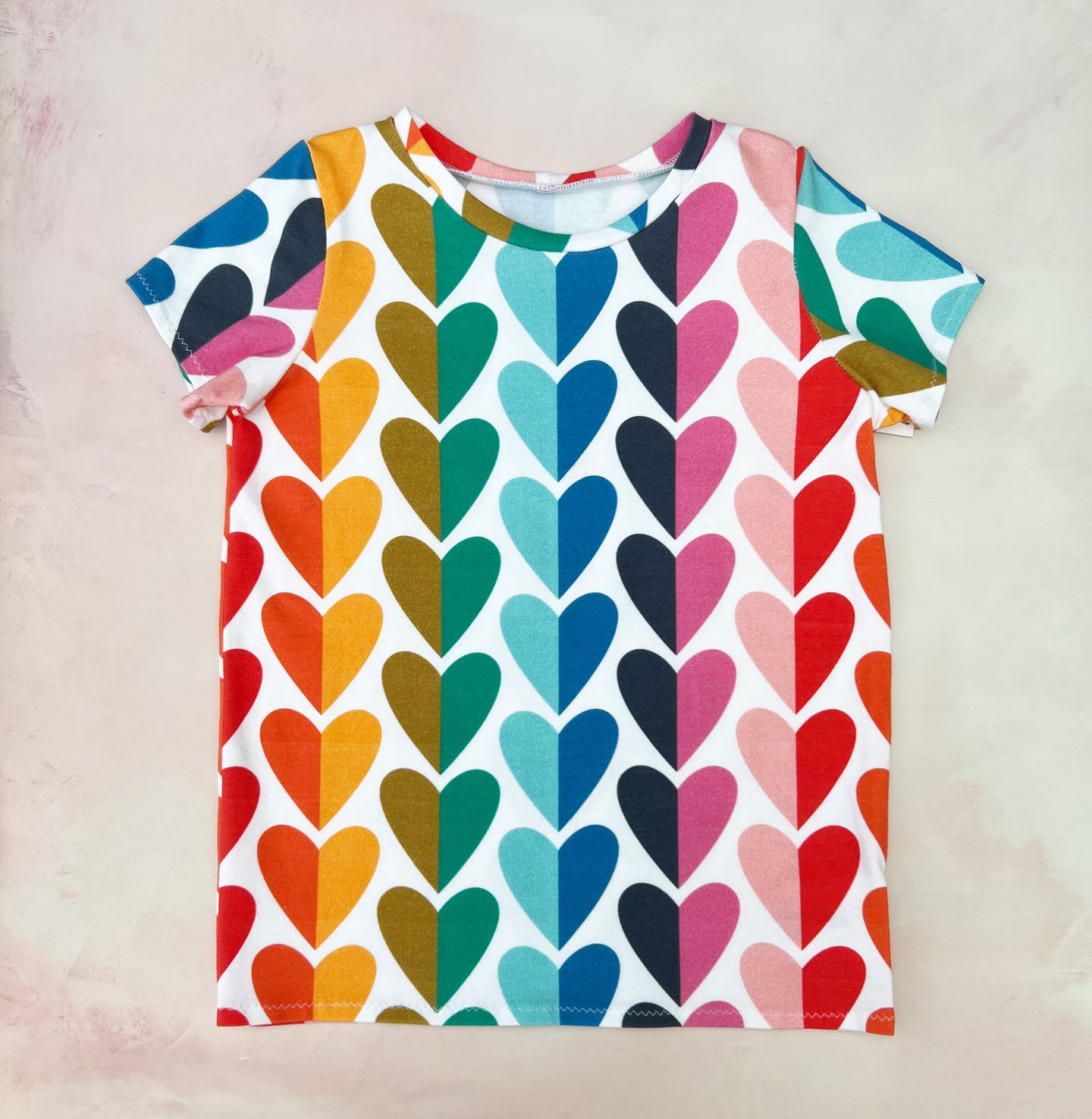 split rainbow hearts tee