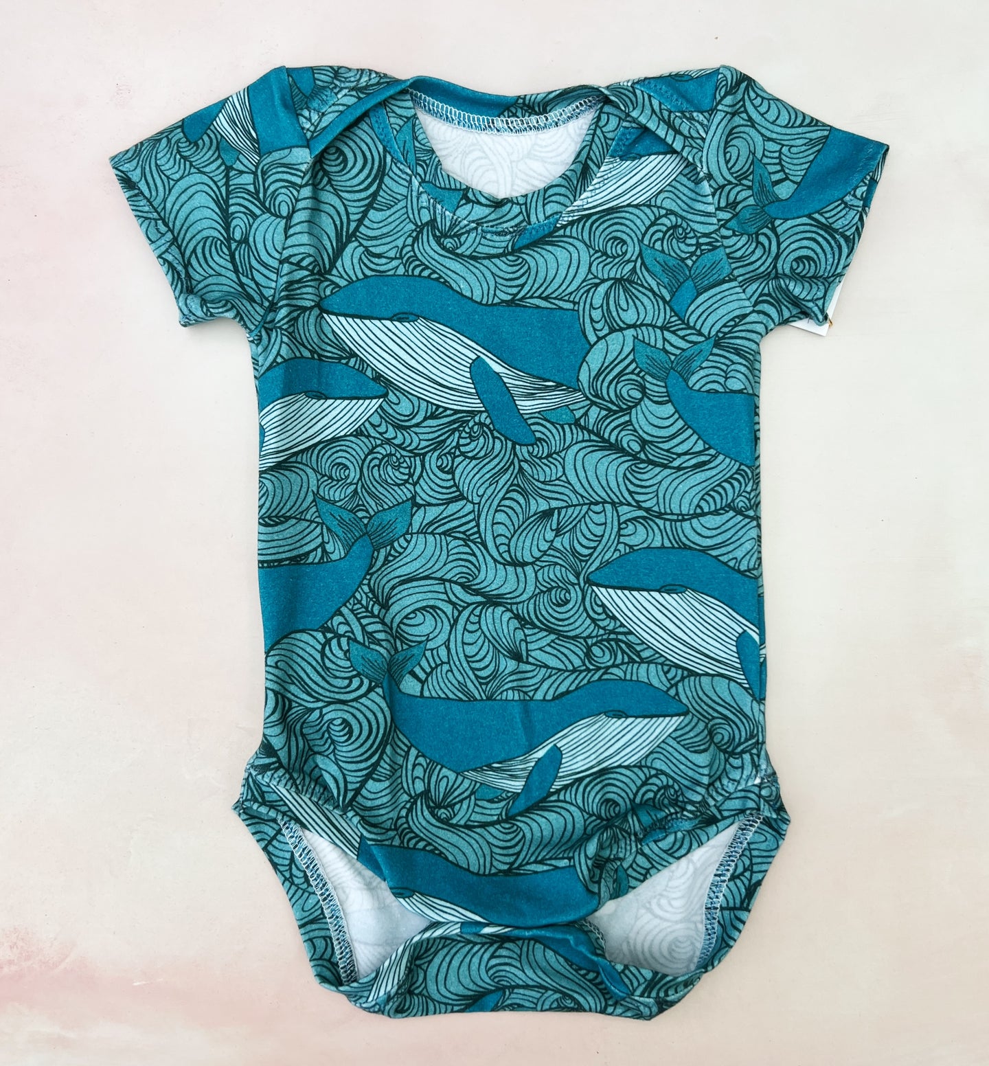 onesie- whales and swirls