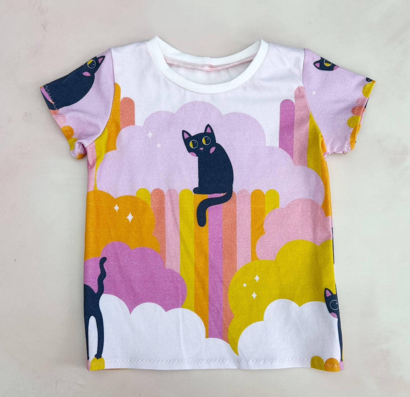black cat on pink tee